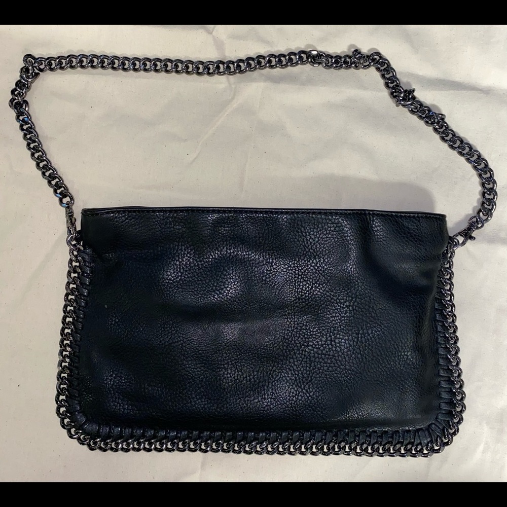 Carlos Santana black purse.